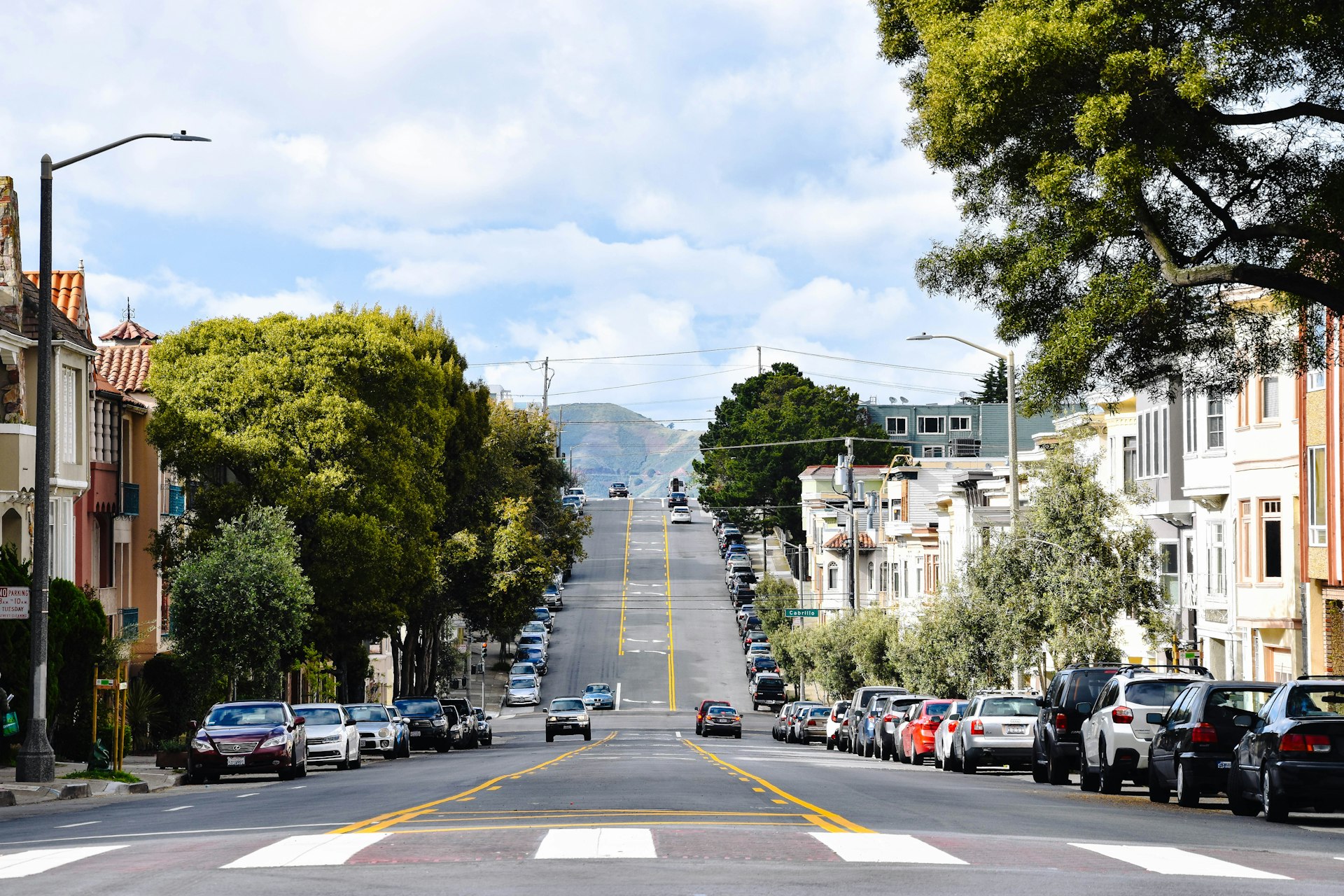 car lot parked on sidewalks